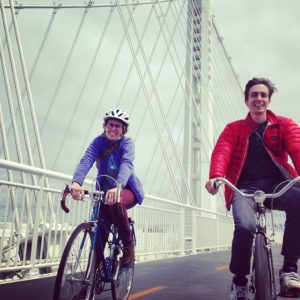 cody-and-kelsey - biking-on-bridge.jpg